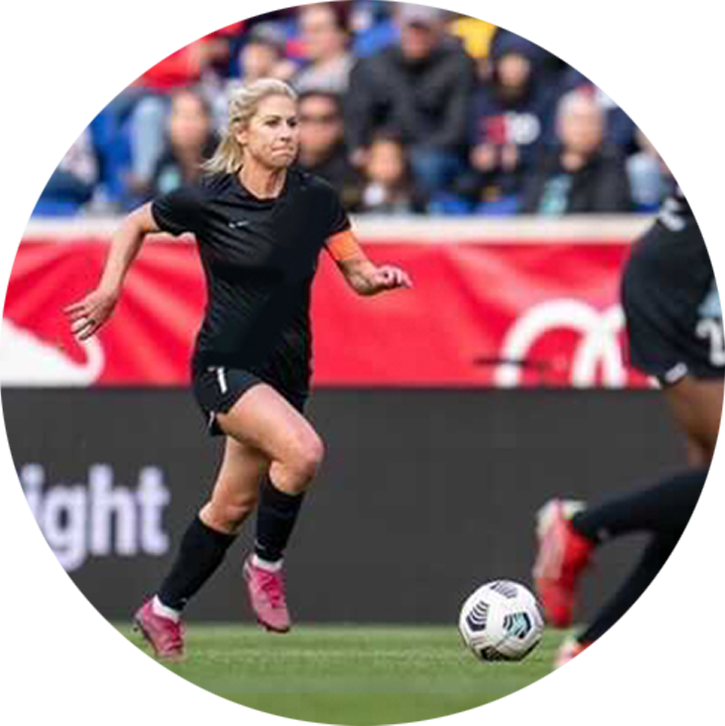 Female professional athletes playing soccer