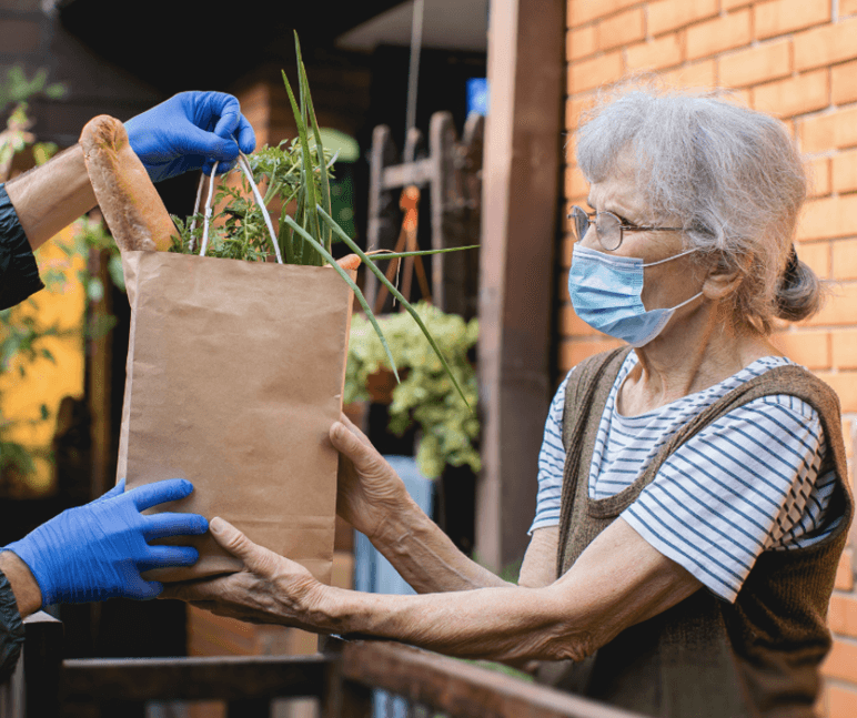 a woman receiving groceries